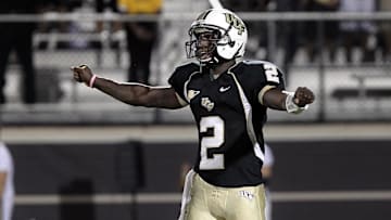 November 3, 2011; Orlando FL, USA; UCF Knights quarterback Jeff Godfrey (2) calls a play during the second quarter against the Tulsa Golden Hurricane at Bright House Networks Stadium. Mandatory Credit: Kim Klement-Imagn Images
