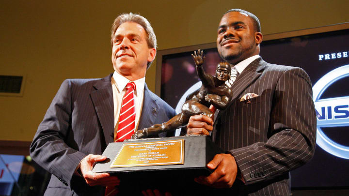 Dec 12, 2009; New York, NY, USA; Alabama Crimson Tide running back Mark Ingram (right) poses with his coach Nick Saban after being awarded the 2009 Heisman Trophy at the Marriott Marquis in New York City.  Mandatory Credit: Shawn O'Connor-USA TODAY Sports