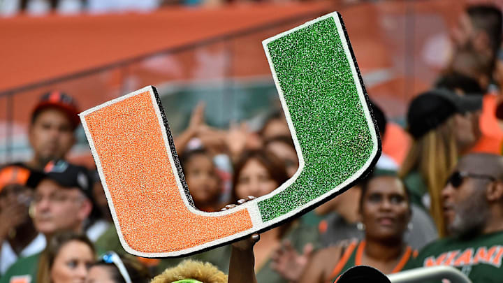 Sep 8, 2018; Miami Gardens, FL, USA; A Miami Hurricanes fan holds a school logo sign during the first half against the Savannah State Tigers at Hard Rock Stadium. Mandatory Credit: Jasen Vinlove-Imagn Images