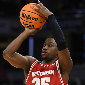 Mar 16, 2025; Indianapolis, IN, USA; Wisconsin Badgers guard John Blackwell (25) shoots a three point basket during the first half against the Michigan Wolverines during the 2025 Big Ten Championship Game at Gainbridge Fieldhouse. Mandatory Credit: Robert Goddin-Imagn Images