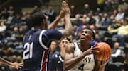 Army's Josh Scovens goes for a layup against Fairleigh Dickinson University's Cameron Tweedy during the game on November 20, 2024.
