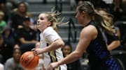 Army's Reese Ericson drives to the net ahead of  Emmanuel College's Angelina Giordano during Monday's game on November 7, 2022.