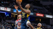 Jan 10, 2024; Indianapolis, Indiana, USA; Indiana Pacers forward Aaron Nesmith (23) shoots the ball while Washington Wizards forward Kyle Kuzma (33) defends in the second half at Gainbridge Fieldhouse. Mandatory Credit: Trevor Ruszkowski-USA TODAY Sports