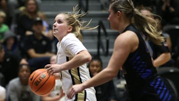Army's Reese Ericson drives to the net ahead of  Emmanuel College's Angelina Giordano during Monday's game on November 7, 2022.