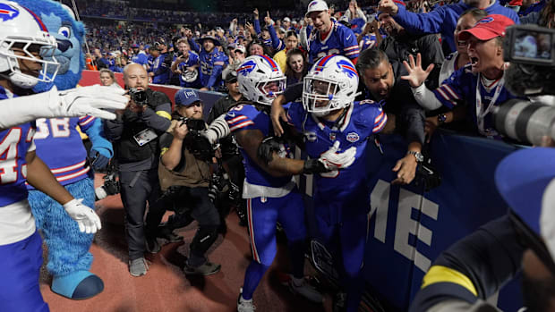 Fans celebrate with Buffalo Bills linebacker Terrel Bernard after he recovered the fumble Ravens made