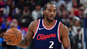 Apr 24, 2025; Inglewood, California, USA; Los Angeles Clippers forward Kawhi Leonard (2) moves the ball up court against the Denver Nuggets during the second half of game three in the first round for the 2024 NBA Playoffs at Intuit Dome. Mandatory Credit: Gary A. Vasquez-Imagn Images