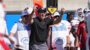 Oct 19, 2024; Berkeley, California, USA; North Carolina State Wolfpack head coach Dave Doeren (center) yells during the second quarter against the California Golden Bears at California Memorial Stadium. Mandatory Credit: Darren Yamashita-Imagn Images