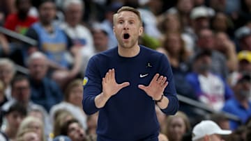 April 11, 2025; Denver, Colorado, USA; Tuomas Iisalo giving instructions during the Grizzlies' away game against the Denver Nuggets 