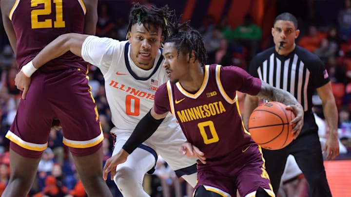 Feb 28, 2024; Champaign, Illinois, USA; Minnesota Golden Gophers guard Elijah Hawkins (0) drives the ball past Illinois Fighting Illini guard Terrence Shannon Jr. (0) during the second half at State Farm Center. Mandatory Credit: Ron Johnson-Imagn Images