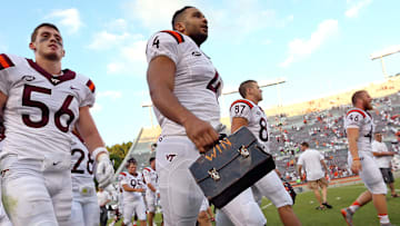 Virginia Tech Hokies defensive end Ken Ekanem (4) carries the lunch pail