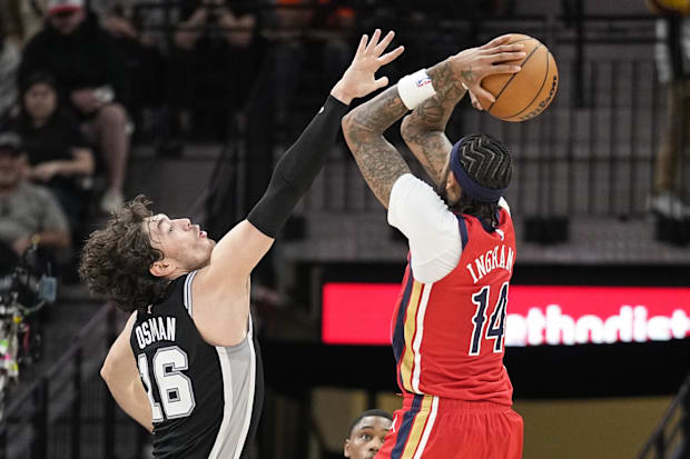 New Orleans Pelicans forward Brandon Ingram (14) shoots over San Antonio Spurs forward Cedi Osman (16) during the second half