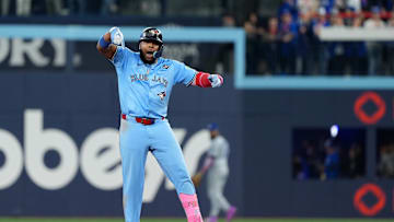 Oct 31, 2025; Toronto, Ontario, CAN; Toronto Blue Jays first baseman Vladimir Guerrero Jr. (27) hits a double in the sixth inning for game six of the 2025 MLB World Series at Rogers Centre. Mandatory Credit: Nick Turchiaro-Imagn Images