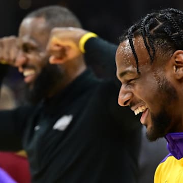 Oct 30, 2024; Cleveland, Ohio, USA; Los Angeles Lakers guard Bronny James, right, and forward LeBron James warm up before the game between the Cleveland Cavaliers and the Lakers at Rocket Mortgage FieldHouse. Mandatory Credit: Ken Blaze-Imagn Images