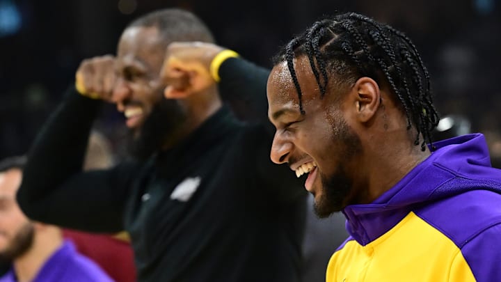 Oct 30, 2024; Cleveland, Ohio, USA; Los Angeles Lakers guard Bronny James, right, and forward LeBron James warm up before the game between the Cleveland Cavaliers and the Lakers at Rocket Mortgage FieldHouse. Mandatory Credit: Ken Blaze-Imagn Images