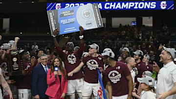 Mar 7, 2023; Washington, D.C., USA;  Charleston Cougars hoist their ticket to the 2023 March Madness tournament after defeating North Carolina-Wilmington Seahawks in the Colonial Athletic Association championship at Entertainment & Sports Arena. Mandatory Credit: Tommy Gilligan-Imagn Images