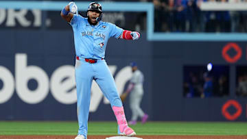 Oct 31, 2025; Toronto, Ontario, CAN; Toronto Blue Jays first baseman Vladimir Guerrero Jr. (27) hits a double in the sixth inning for game six of the 2025 MLB World Series at Rogers Centre. Mandatory Credit: Nick Turchiaro-Imagn Images