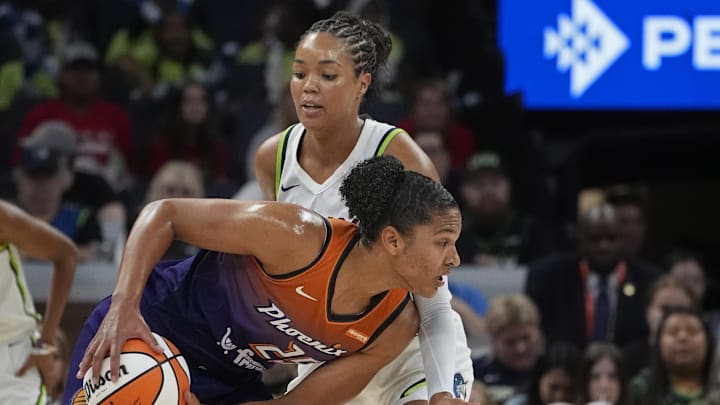 Jul 16, 2025; Minneapolis, Minnesota, USA; Minnesota Lynx forward Napheesa Collier (24) defends against Phoenix Mercury forward Alyssa Thomas (25) in the first quarter at Target Center. Mandatory Credit: Bruce Kluckhohn-Imagn Images