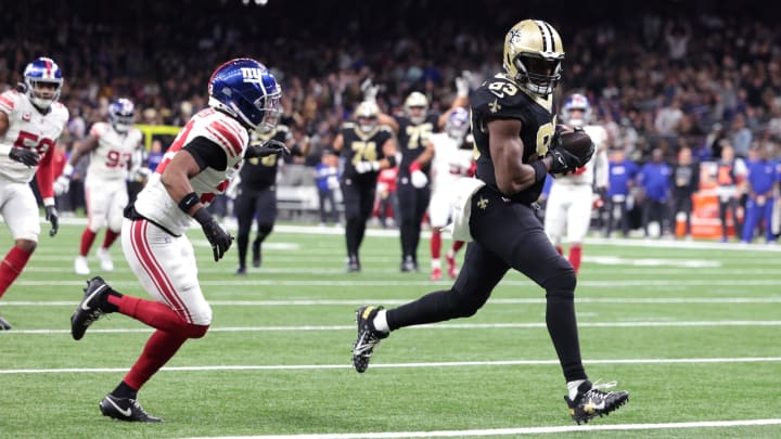 Dec 17, 2023; New Orleans, Louisiana, USA; New Orleans Saints tight end Juwan Johnson (83) scores a touchdown  against the New York Giants during the second half at Caesars Superdome. 