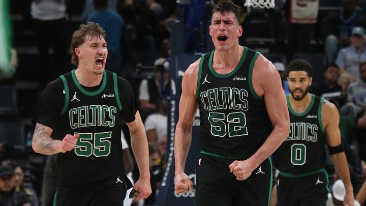 Mar 20, 2026; Memphis, Tennessee, USA; Boston Celtics guard Baylor Scheierman (55) and center Luka Garza (52) react during the fourth quarter against the Memphis Grizzlies at FedExForum.