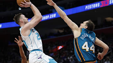 Feb 3, 2023; Detroit, Michigan, USA;  Charlotte Hornets forward Gordon Hayward (20) shoots Bojan Bogdanovic of the Detroit Pistons