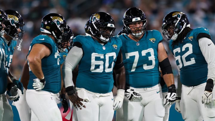 Jacksonville Jaguars center Darryl Williams (60) guard Blake Hance (73) and offensive tackle Javon Foster (62) line up against the Tampa Bay Buccaneers in the third quarter during a preseason game at EverBank Stadium. 