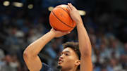 Oct 4, 2025; Charlotte, NC, USA; North Carolina Tar Heels guard Seth Trimble (7) shoots as guard Jaydon Young (4) defends in the second half at Dean E. Smith Center. Mandatory Credit: Bob Donnan-Imagn Images