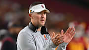 Oct 1, 2022; Los Angeles, California, USA;  USC Trojans head coach Lincoln Riley applauds after a touchdown in the first half against the Arizona State Sun Devils at United Airlines Field at the Los Angeles Memorial Coliseum. Mandatory Credit: Jayne Kamin-Oncea-Imagn Images