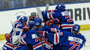 Aug 3, 2024; Plymouth, MI, USA; Team USA celebrates its shootout win over Canada during the of the 2024 World Junior Summer Showcase at USA Hockey Arena. 