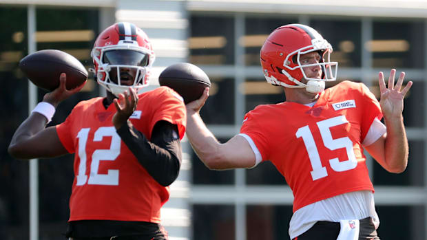 Cleveland Browns quarterback Joe Flacco (15) and quarterback Shedeur Sanders (12) look downfield during NFL training camp