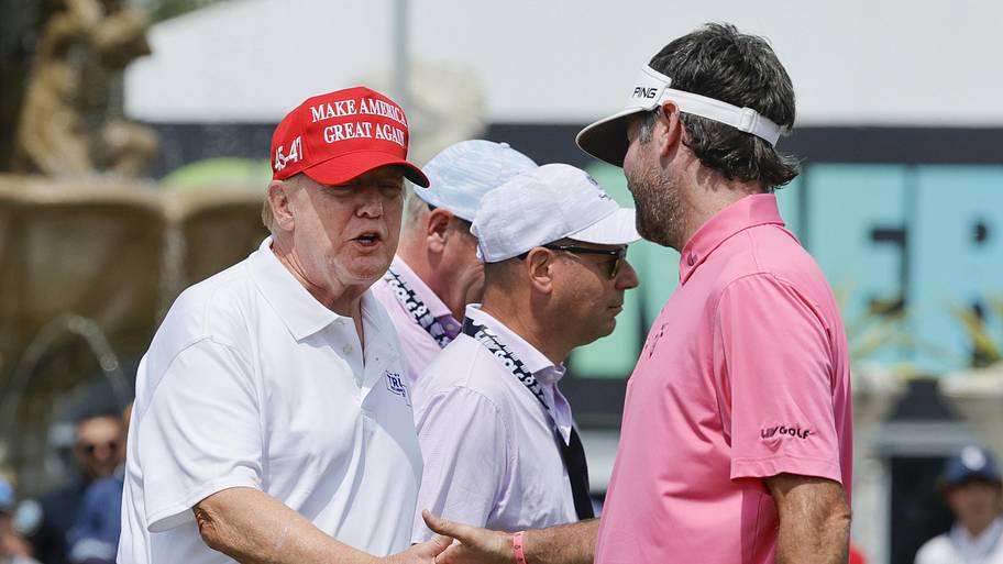 Donald Trump meets with Bubba Watson of the RangeGoats on the practice green before the final round of LIV Golf Miami in 2024