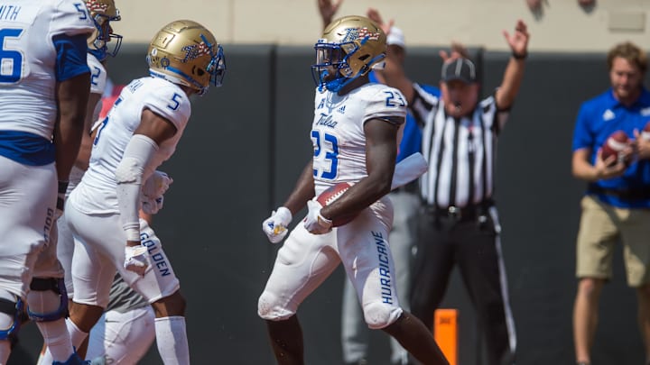 Sep 11, 2021; Stillwater, Oklahoma, USA;  Tulsa Golden Hurricane running back Anthony Watkins (23) celebrates with wide receiver JuanCarlos Santana (5) after his touchdown during the fourth quarter at Boone Pickens Stadium. The Cowboys won 28-23. Mandatory Credit: Brett Rojo-Imagn Images