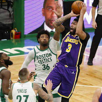 Jan 30, 2021; Boston, Massachusetts, USA; Los Angeles Lakers forward Anthony Davis (3) shoots over three Boston Celtics including guard Marcus Smart (36) during the third quarter at TD Garden. Mandatory Credit: Winslow Townson-Imagn Images