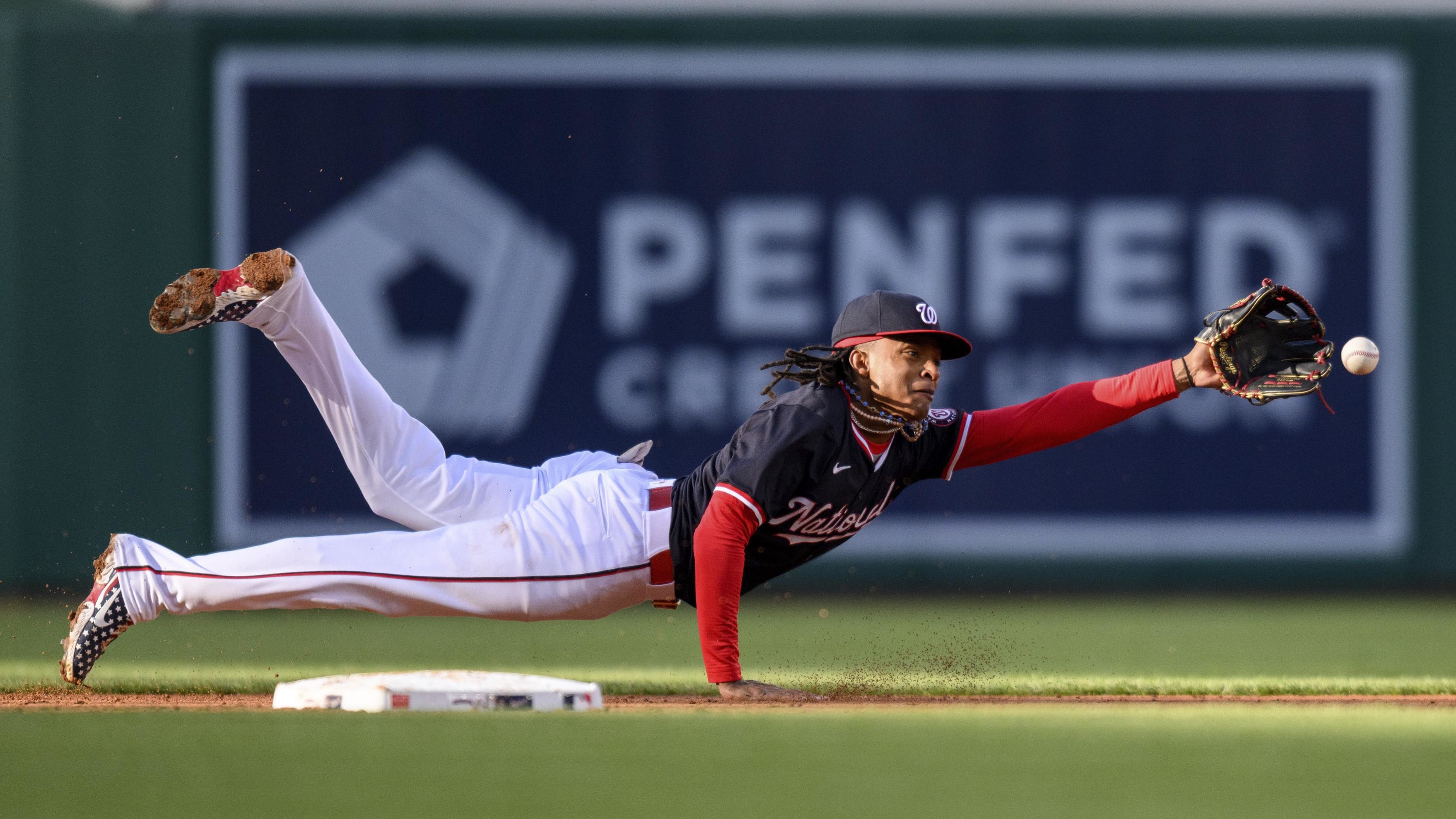 Apr 4, 2024; Washington, District of Columbia, USA; Washington Nationals shortstop CJ Abrams (5) makes a diving stop.