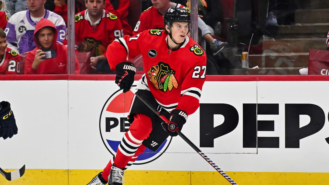 Sep 28, 2023; Chicago, Illinois, USA;  Chicago Blackhawks forward Lukas Reichel (27) skates against the St. Louis Blues at United Center. Mandatory Credit: Jamie Sabau-USA TODAY Sports