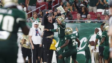 Sep 9, 2023; Tampa, Florida, USA; South Florida Bulls head coach Alex Golesh celebrates quarterback Byrum Brown (17) touchdown against Florida A&M Rattlers during the third quarter at Raymond James Stadium. Mandatory Credit: Morgan Tencza-USA TODAY Sports