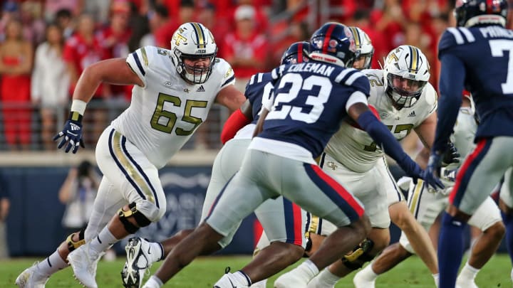 Sep 16, 2023; Oxford, Mississippi, USA; Georgia Tech Yellow Jackets offensive linemen Connor Scaglione (65) and Weston Franklin (72) block during the first half against the Mississippi Rebels at Vaught-Hemingway Stadium. Mandatory Credit: Petre Thomas-USA TODAY Sports