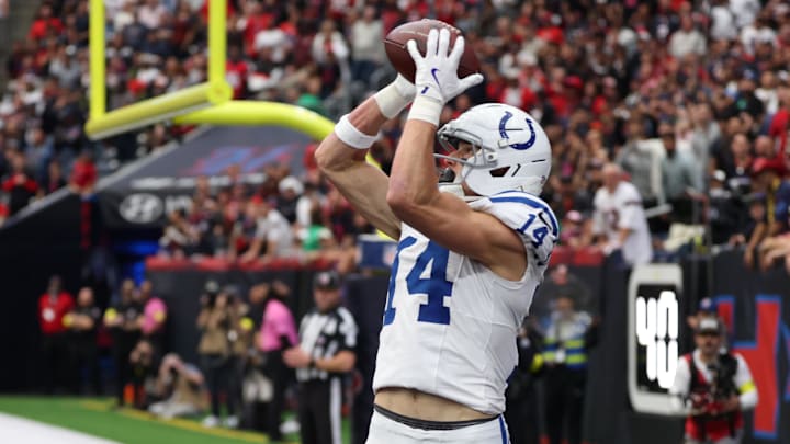 Jan 4, 2026; Houston, Texas, USA;  Indianapolis Colts wide receiver Alec Pierce (14) catches a touchdown pass against the Houston Texans during the first half at NRG Stadium. Mandatory Credit: Thomas Shea-Imagn Images