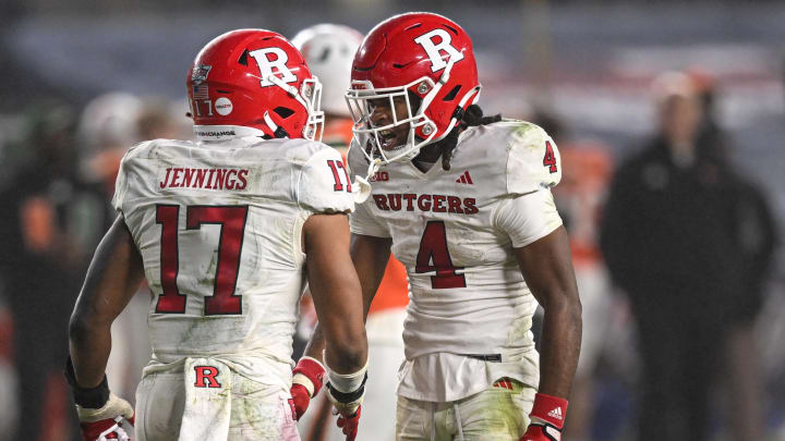 Dec 28, 2023; Bronx, NY, USA; Rutgers Scarlet Knights linebacker Deion Jennings and Rutgers Scarlet Knights defensive back Desmond Igbinosun.