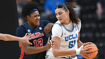 Mar 28, 2025; Spokane, WA, USA; UCLA Bruins center Lauren Betts (51) fights for position against Ole Miss Rebels forward Christeen Iwuala (12). during the first half of a Sweet 16 NCAA Tournament basketball game at Spokane Arena. at Spokane Arena. Mandatory Credit: James Snook-Imagn Images