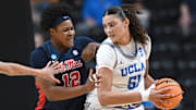 UCLA Bruins center Lauren Betts fights for position against Ole Miss Rebels forward Christeen Iwuala.