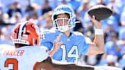 Oct 4, 2025; Chapel Hill, North Carolina, USA; North Carolina Tar Heels quarterback Max Johnson (14) looks to pass as Clemson Tigers defensive end T.J. Parker (3) pressures in the second quarter at Kenan Stadium. Mandatory Credit: Bob Donnan-Imagn Images