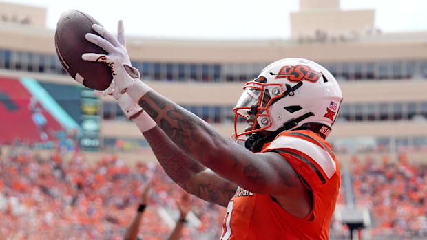 Oklahoma State running back Ollie Gordon celebrates a touchdown.