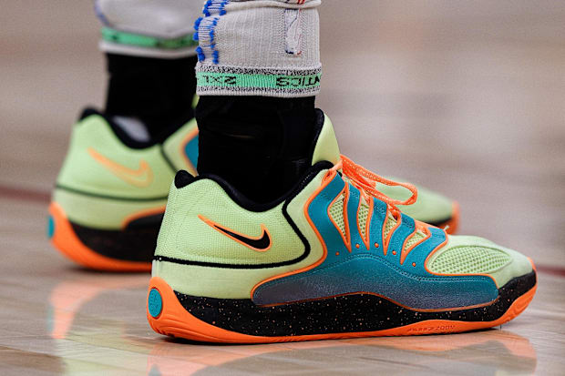 Chet Holmgren's green and orange Nike shoes.