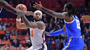 Feb 11, 2025; Champaign, Illinois, USA;  Illinois Fighting Illini guard Kylan Boswell (4) looks to pass as UCLA Bruins guard Sebastian Mack (12) defends during the first half at State Farm Center. Mandatory Credit: Ron Johnson-Imagn Images