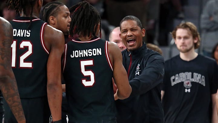 Mar 9, 2024; Starkville, Mississippi, USA; South Carolina Gamecocks head coach Lamont Paris reacts with guard Meechie Johnson (5) during a time out during the second half against the Mississippi State Bulldogs at Humphrey Coliseum. Mandatory Credit: Petre Thomas-Imagn Images