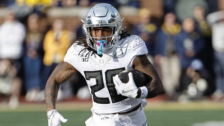 Nov 2, 2024; Ann Arbor, Michigan, USA;  Oregon Ducks running back Jordan James (20) rushes against the Michigan Wolverines at Michigan Stadium. Mandatory Credit: Rick Osentoski-Imagn Images