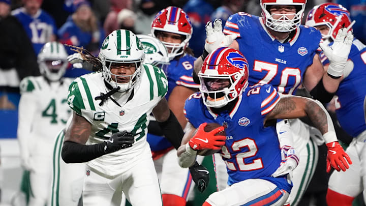 Jan 4, 2026; Orchard Park, New York, USA; Buffalo Bills running back Ray Davis (22) carries the ball defended by New York Jets linebacker Jamien Sherwood (44) during the second half at Highmark Stadium. Mandatory Credit: Gregory Fisher-Imagn Images