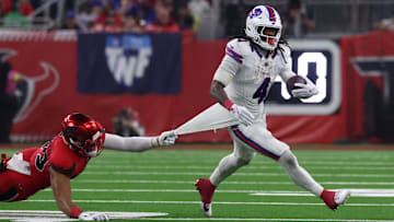 Nov 20, 2025; Houston, Texas, USA; Buffalo Bills running back James Cook III (4) runs against Houston Texans linebacker Henry To'oTo'o (39) in the fourth quarter at NRG Stadium.
