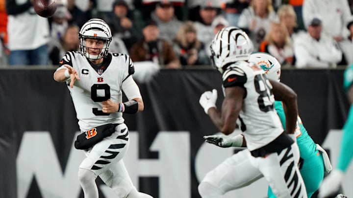 Sep 29, 2022; Cincinnati, Ohio, USA; Cincinnati Bengals quarterback Joe Burrow (9) throws on the run to Cincinnati Bengals wide receiver Tee Higgins (85) in the fourth quarter against the Miami Dolphins at Paycor Stadium in Cincinnati. The Cincinnati Bengals won, 27-15 to improve to 2-2 on the season. Mandatory Credit: Kareem Elgazzar-Imagn Images