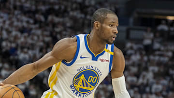 May 8, 2025; Minneapolis, Minnesota, USA; Golden State Warriors forward Jonathan Kuminga (00) dribbles the ball against the Minnesota Timberwolves in the second half during game two of the second round for the 2025 NBA Playoffs at Target Center. Mandatory Credit: Jesse Johnson-Imagn Images